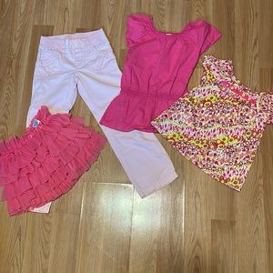 Lot of spring clothes for girls, in pinks and yellows. 🥰